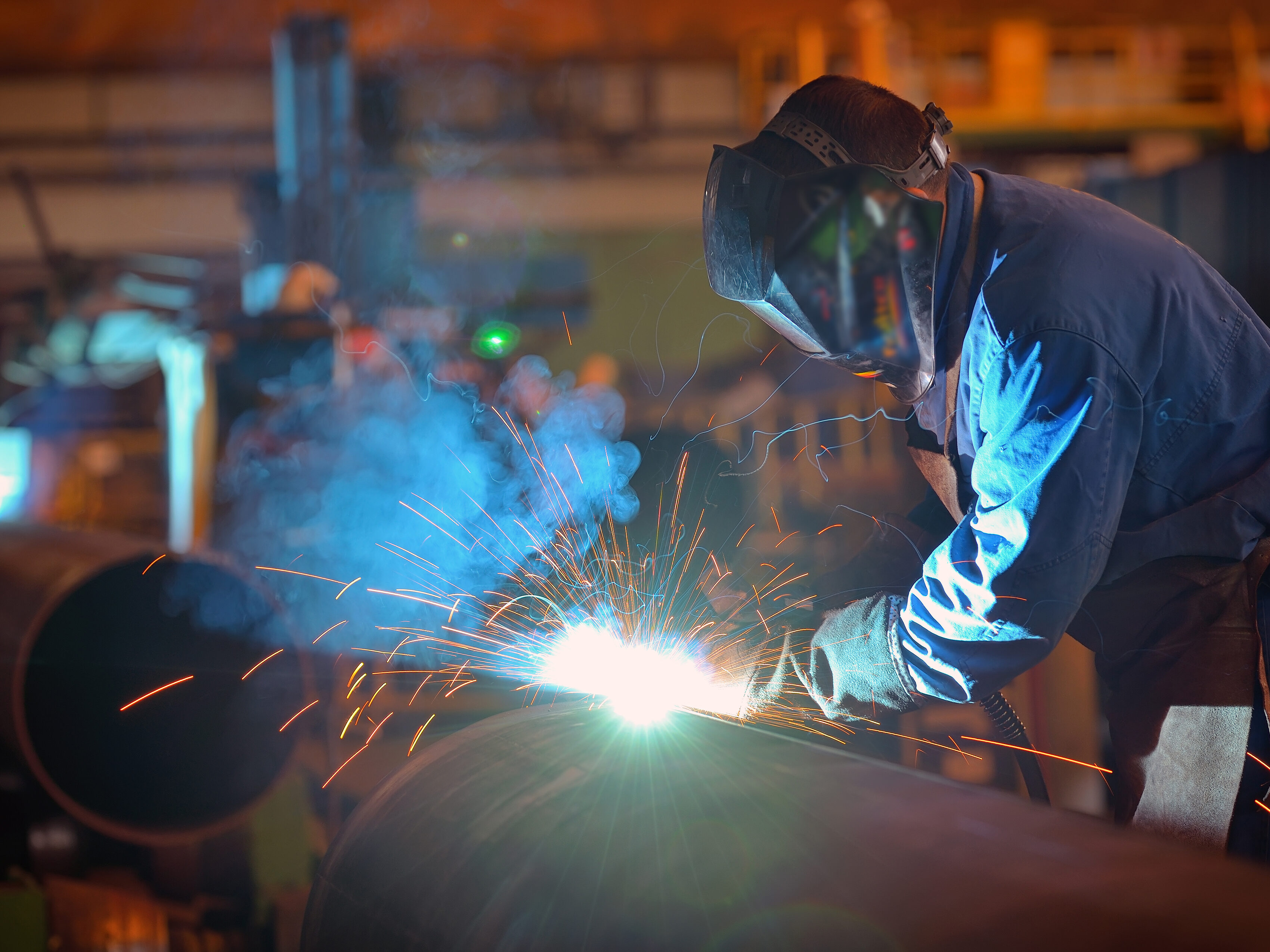 Welder performs welding large diameter pipe
